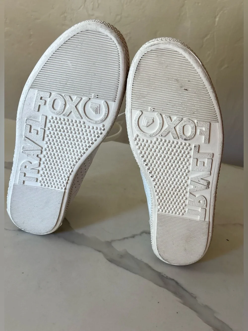 Travel Fox white sneakers size 7 back tab has a tear